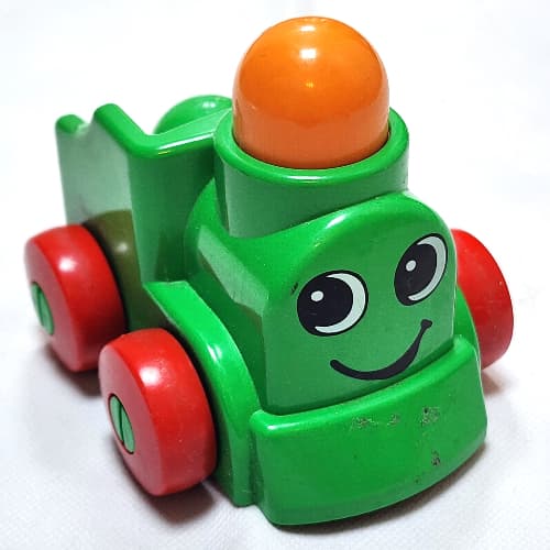 Primo Train Engine 1 x 2 with Red Wheels, Orange Button, and Face Print