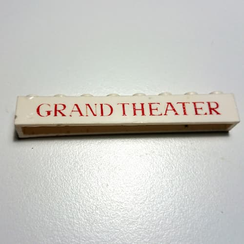Brick 1 x 8 without Bottom Tubes with Cross Side Supports with 'GRAND THEATER' Thin Red Print