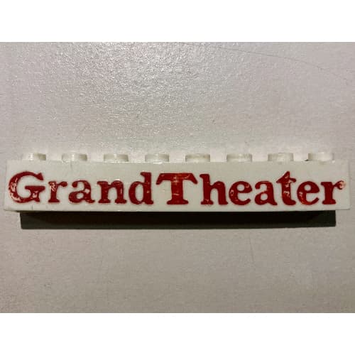 Brick 1 x 8 without Bottom Tubes with Cross Side Supports with 'Grand Theater' Bold Red Print