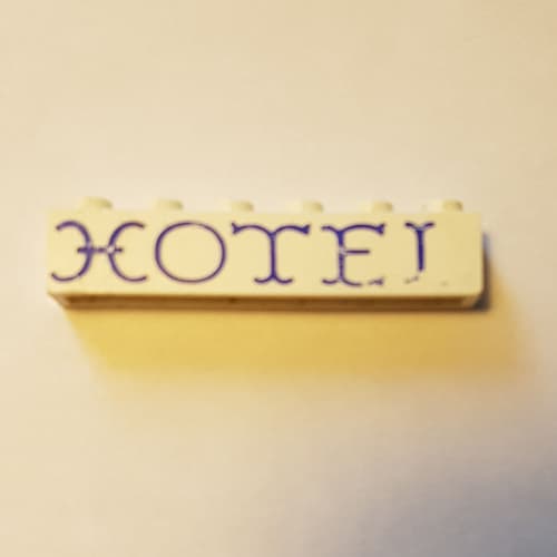 Brick 1 x 6 without Bottom Tubes with Cross Side Supports with 'HOTEL' Curvy Blue Print