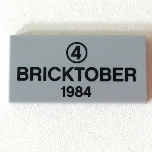 Tile 2 x 4 with Black '4' in Circle and 'BRICKTOBER 1984' Print